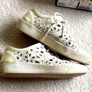 CHANEL “Camelia Laser cut” leather sneakers
